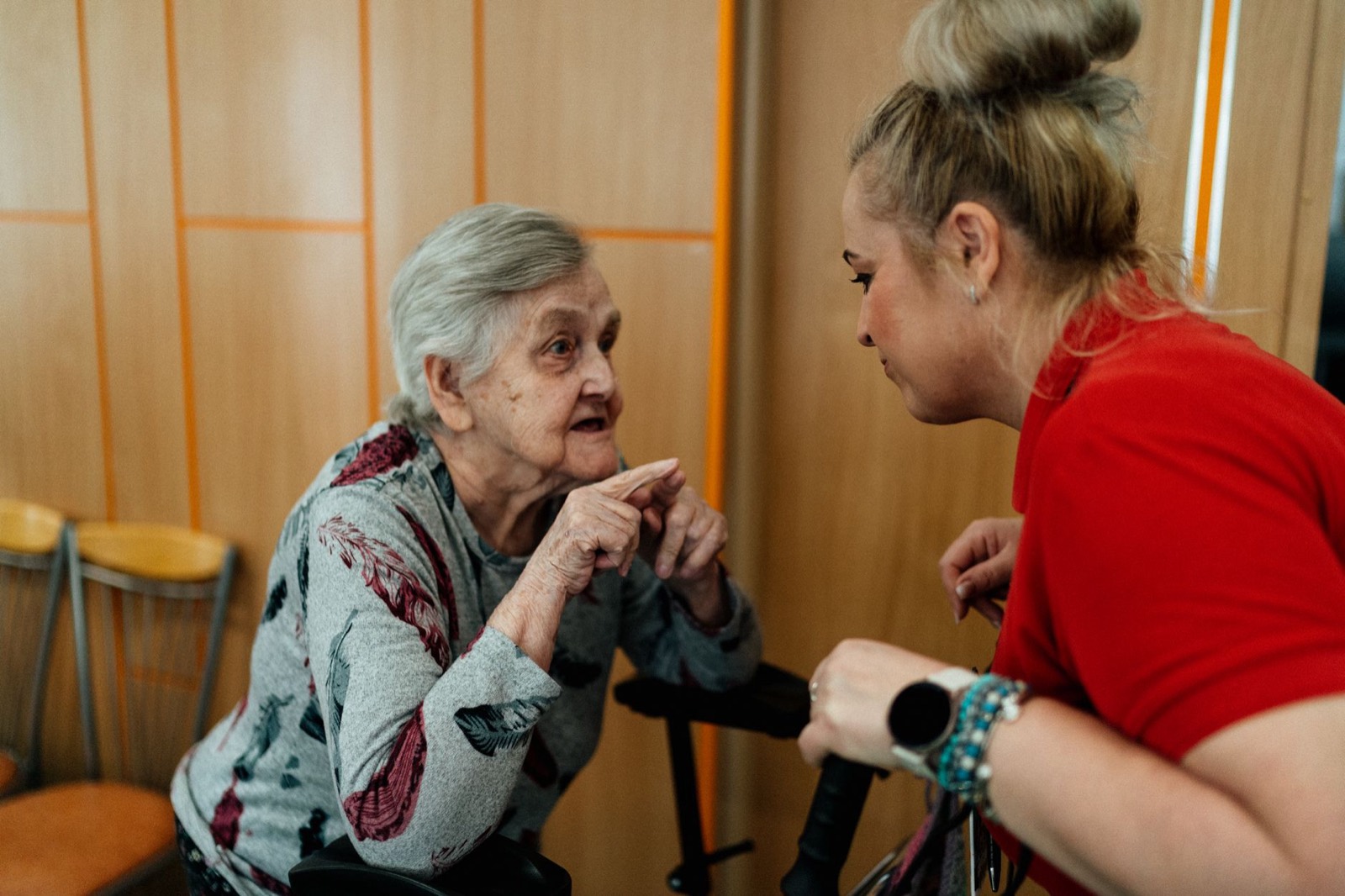 Care worker talking with an elderly resident
